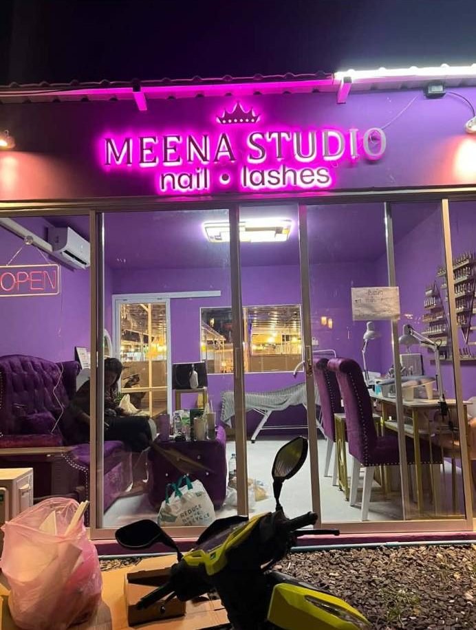 Meena Studio shop front with pink neon sign