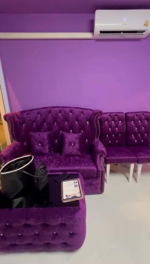 Purple velvet tufted sofa in the Meena Studio lounge